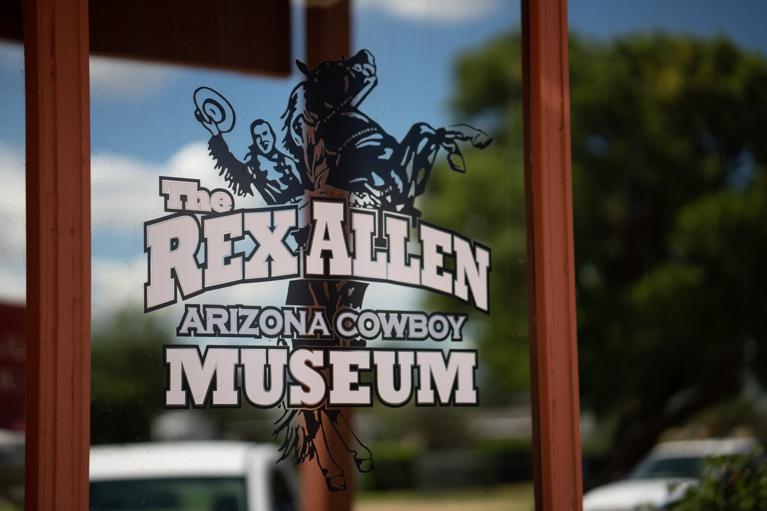 the rex allen arizona cowboy museum logo on window
